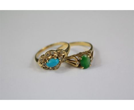 A 14ct Yellow Gold Turquoise Ring. The central stone measures approx 5x3mm, size N approx 2.7 gms together with an 18ct yello