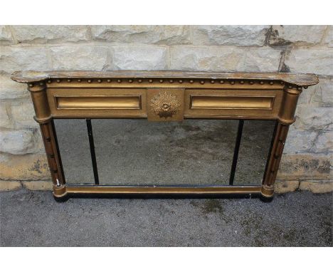 A Regency Gold/Black Painted Over-mantle Mirror. The mirror having two side supports with three plates, the pediment mounted 