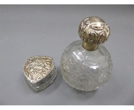 Two Cut Glass Vanity Jars. This lot includes a large scent bottle, the silver top bears a London hallmark, mm CJF together wi