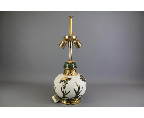 A Contemporary Italian-Style Glass and Enamel-Painted Lamp Base. The lamp base with floral decoration in relief highlighted w