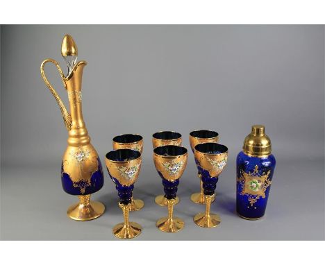 A Set of 20th Century Bohemian Decanter and Glasses. The set includes six blue white-wine glasses with gold-coloured enamel o