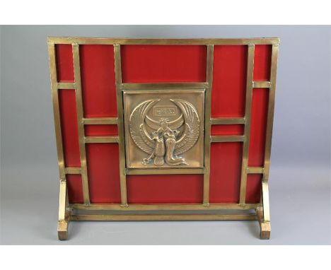 An Art Deco Style Bronze and Red Enamel Painted Fire Screen. The fire screen with central panel depicting the Egyptian goddes