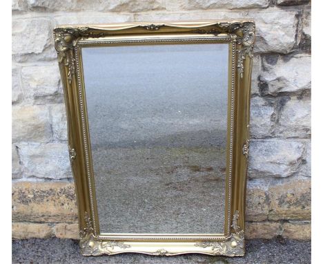 A Gilt Framed Bevelled Mirror. The mirror approx 75 x 50 cms.&nbsp;