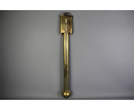 An Early 19th Century Brass Stick Barometer. The barometer surmounted by a swan neck pediment over a bow-fronted dial and lon