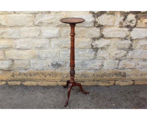 A Mahogany Plant Stand. The stand with decorative carving raised on tripod base, approx 113 cms.