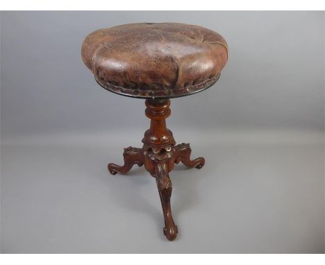A circa 1810 rush-seated ladder-back elbow chair. The chair having turned legs and stretchers, approx 52 x 99 cms together wi