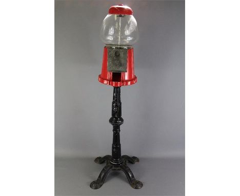 A Vintage 'Great Northern' Canadian Gumball Dispenser. The dispenser and stand made of Red/Black Cast Metal, label to top, ap