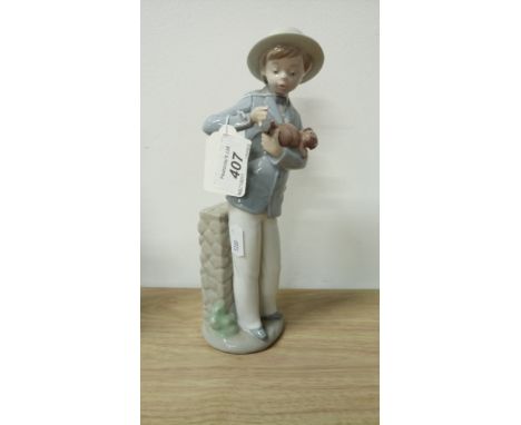 NAO LLADRO - BOY HOLDING DOG