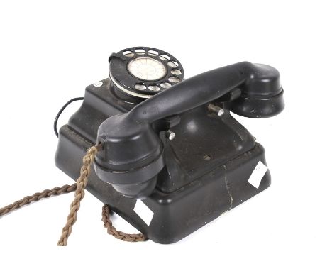 A vintage ATM bakelite wall mounted rotary telephone. L20cm