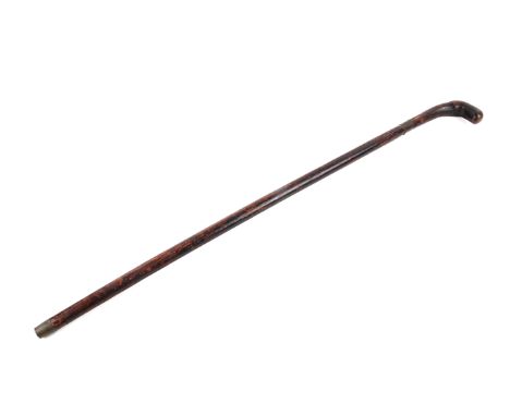 A 20th century sword stick. The natural wooden handle attached to a square sectioned tapering blade, having a copper collar a