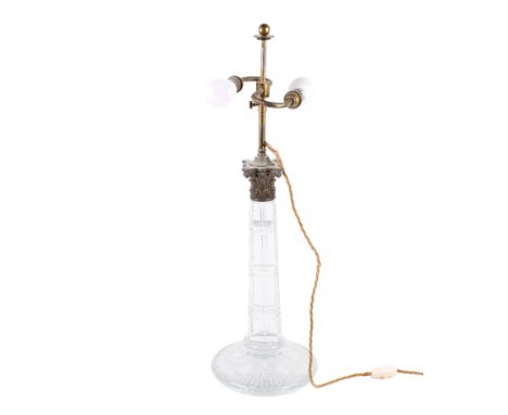 A 20th century fine glass table lamp. With a tapered octagonal column, Corinthian-style cast brass capital and circular base,
