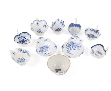 A collection of 18th century and later Worcester ceramics. Comprising seven cups, two dishes and a bowl, all glazed in blue a