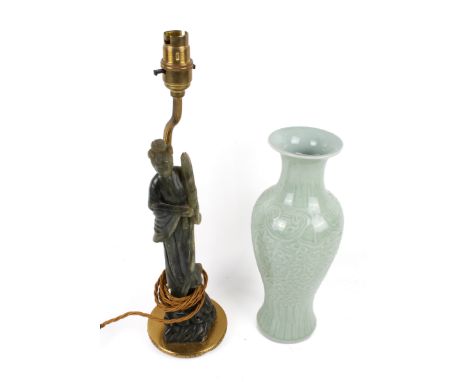 Two assorted Chinese table lamp bases. One carved as a female figure with a fan and scroll the other a celadon green glazed b
