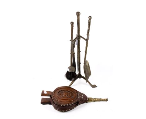 A set of steel fireside tools and a set of oak bellows. With stand, H57cm.