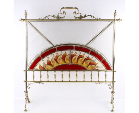A late Victorian brass and stained glass firescreen. Brass frame with leaded, stained and painted glass panels featuring flam