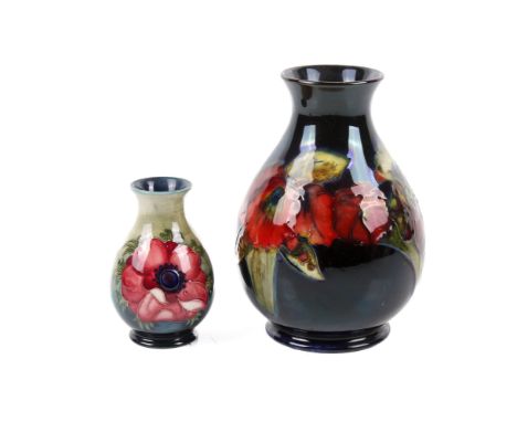 Two 20th century Moorcroft Pottery baluster vases. Including a signed 'iris' with printed and painted marks to base, H15.5cm,