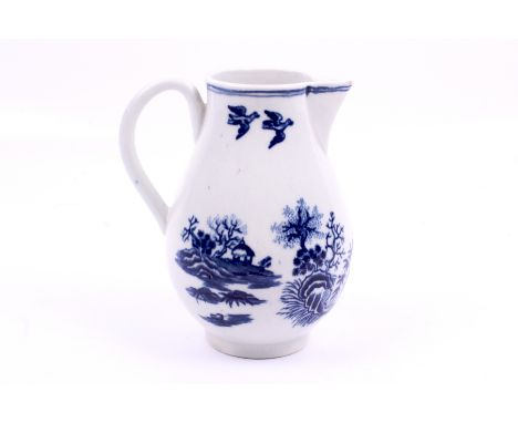 A circa 1770 'First Period' Worcester sparrow beak milk jug. Decorated in the fence pattern with a pair of birds flying over 