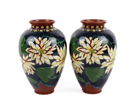 A pair of Wileman & Co Foley Intarsio 'Water Lily' pattern vases. Model 3022, decorated with pale yellow flowers on a dark bl