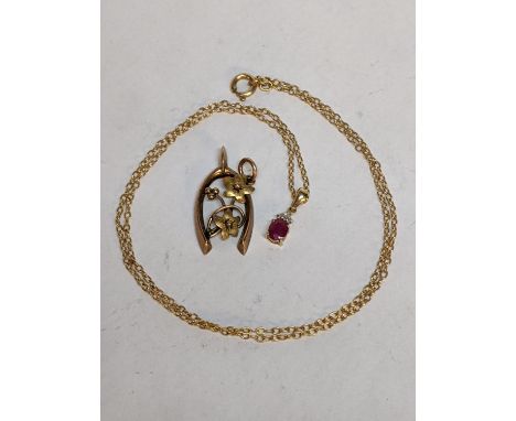 A 9ct gold pendant, together with a 9ct gold necklace and pendant inset with a ruby and diamonds, 3g 