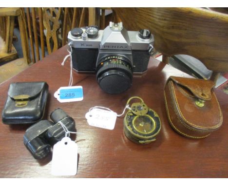 A Carl Zeiss Turmon 8 x monocular in black leather case, a Pentax K1000, and a leather cased Barker's patent military issue W