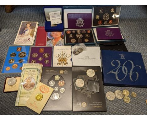 A coin collection to include American silver proof sets, various mint cased sets, a Victorian shilling and others 