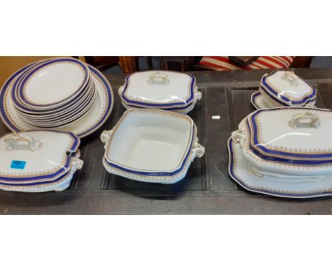 A Royal Worcester part dinner service having a white ground with a gold and blue coloured border Location: RAB 