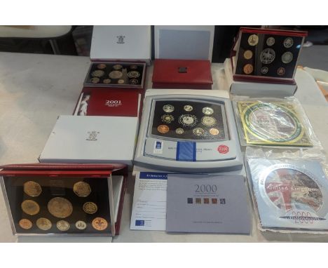 A group of eight UK uncirculated coin sets to include UK Deluxe Proof sets 1998-2002, along with Brilliant uncirculated coin 