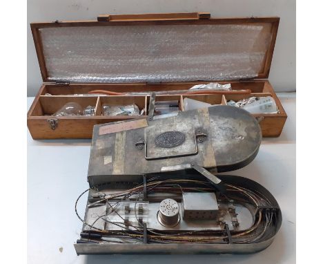 A vintage Ureteric Catheter in original metal Arnold &amp; Sons case and a wooden box containing a scientific machine, Locati