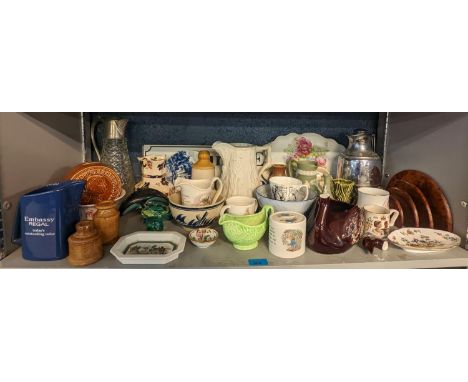 A mixed lot of ceramics and other items to include Beatrix Potter Wedgwood items, Spode, glass paperweight, Poole pottery dol