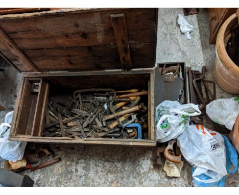 Vintage tools contained in a pine chest, to include hammers, files, spanners, saws and other items Location: 