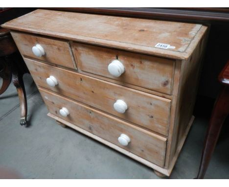 An old stripped pine 2 over 2 chest of drawers with ceramic knobs, COLLECT ONLY.90cm x 43cm x height 80cm