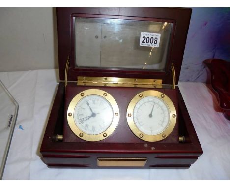 A cased brass clock and barometer.The clock is quartz and working when checked. Also the barometer reading is consistent with