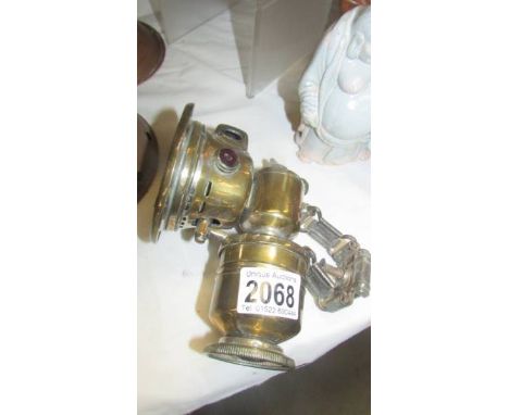 A brass cycle lamp.