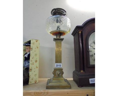 A Victorian brass oil lamp base with glass font. COLLECT ONLY.