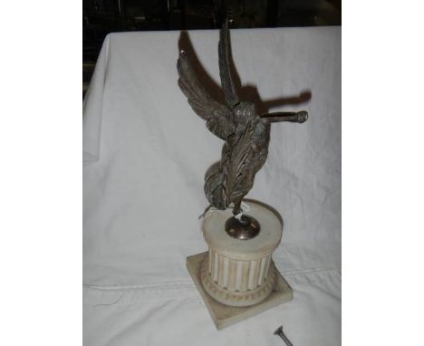 A metal figure on a bisque base (possibly Elkington), damage to horn.