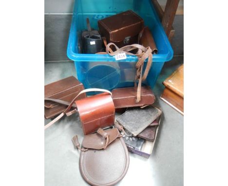 A box of leather camera cases, collar boxes etc.,