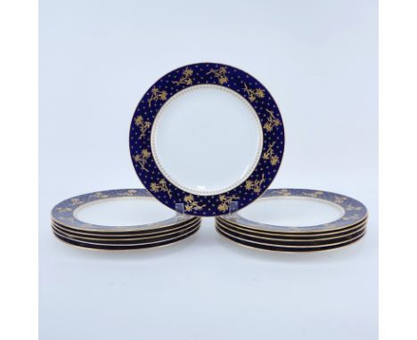 Eleven (11) Brownfields For Tiffany Cobalt and Gold Rimmed Porcelain Plates. Signed. Minor wear to edges. Measures 10-1/8" Di
