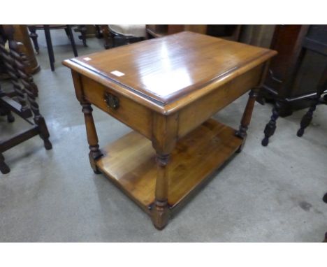 A George III style walnut single drawer lamp table 