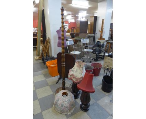 A pair of mahogany table lamps, a standard lamp and a fire screen 