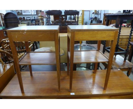 A pair of teak and Formica topped lamp tables 