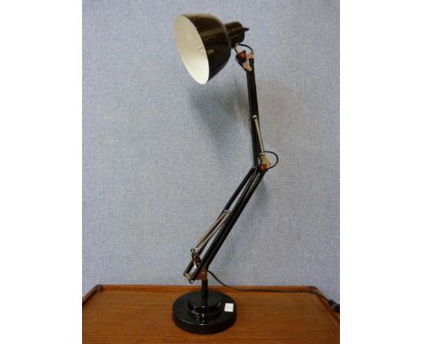 A black anglepoise desk lamp 