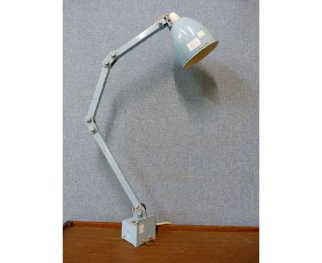 A Memlite articulated industrial machinists lamp 