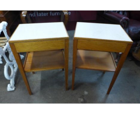 A pair of teak and Formica topped lamp tables 