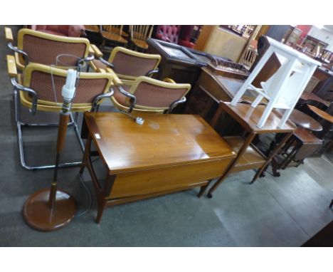 A teak drop-leaf coffee table, a trolley, a teak standard lamp and one other 