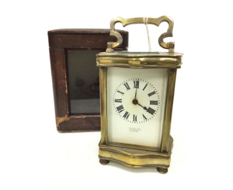 EARLY 20TH CENTURY CARRIAGE CLOCK BY STEWART &amp; CO. OF LONDON, the white enamel dial with Roman numerals, contained in a b