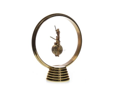 JAEGER LE COULTRE MANTEL CLOCK, with skeleton movement, gilt hands and frame, on a ribbed tapering foot, 18cm high, with orig