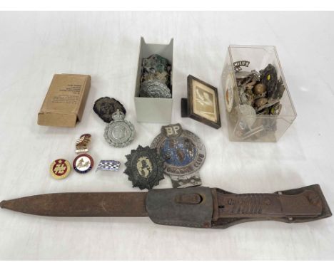 Military bayonet with scabbard, German wound badge, enamel Speedway badges, car mascot, Police and Military cap badges, Railw