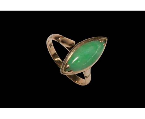 Green jade 18 carat gold ring, size M.