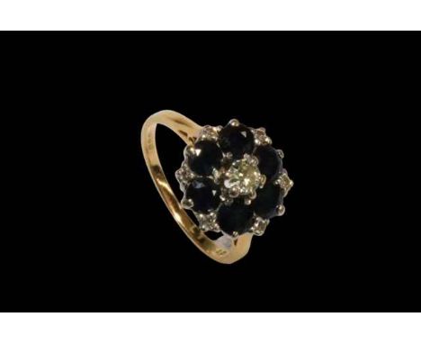 Sapphire and diamond 18 carat gold cluster ring, size J/K.