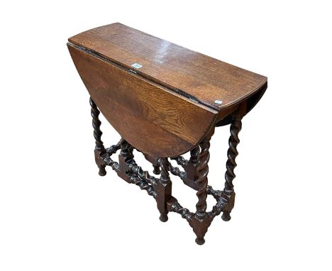 Neat jointed oak barley twist gate leg table, 63cm by 74cm by 27cm (leaves down).